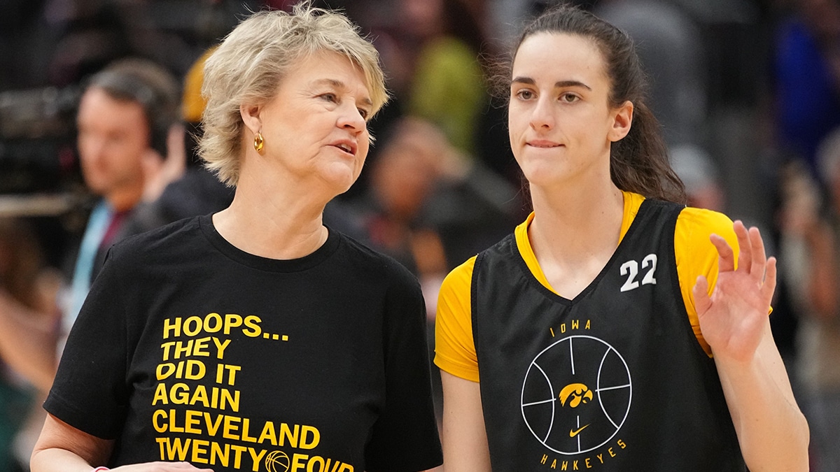 owa Hawkeyes head coach Lisa Bluder and Iowa Hawkeyes guard Caitlin Clark (22) talk during practice for the NCAA Women's Final Four championship basketball game between Iowa and South Carolina at Rocket Mortgage Fieldhouse, 