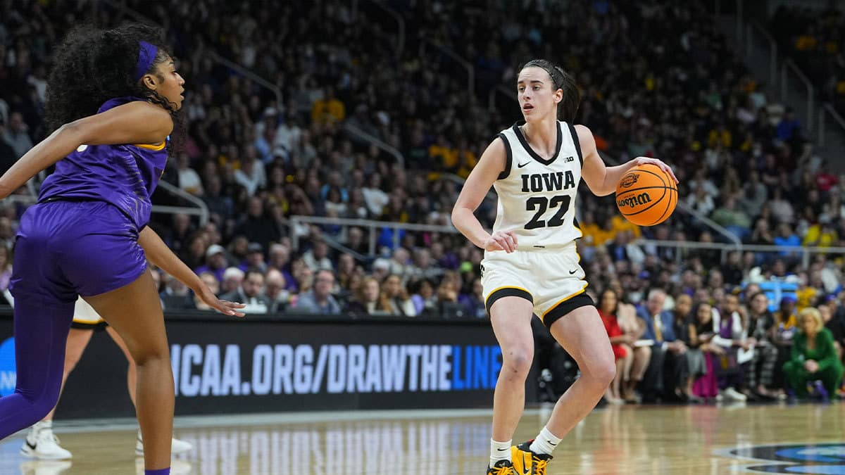 Iowa Hawkeyes guard Caitlin Clark (22) controls the ball against LSU Lady Tigers forward Angel Reese (10) in the third quarter in the finals of the Albany Regional in the 2024 NCAA Tournament at MVP Arena