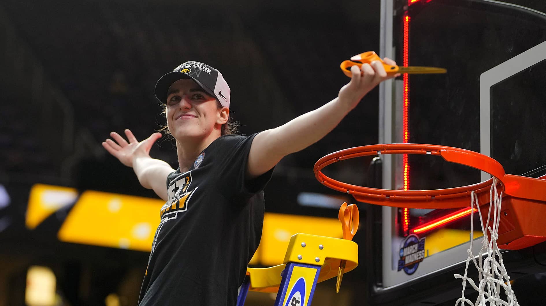 Iowa Hawkeyes guard Caitlin Clark (22) cuts the net after defeating the LSU Lady Tigers in the finals of the Albany Regional in the 2024 NCAA Tournament.