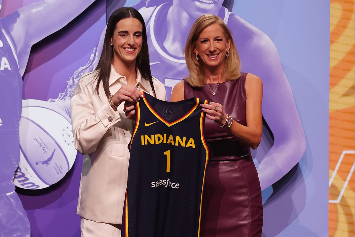 Caitlin Clark poses with WNBA commissioner Cathy Engelbert after she is selected with the number one overall pick to the Indiana Fever in the 2024 WNBA Draft at Brooklyn Academy of Music