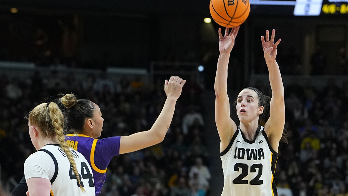 Iowa Hawkeyes guard Caitlin Clark (22) shoots against LSU Lady Tigers guard Last-Tear Poa (13) in the third quarter in the finals of the Albany Regional in the 2024 NCAA Tournament at MVP Arena.