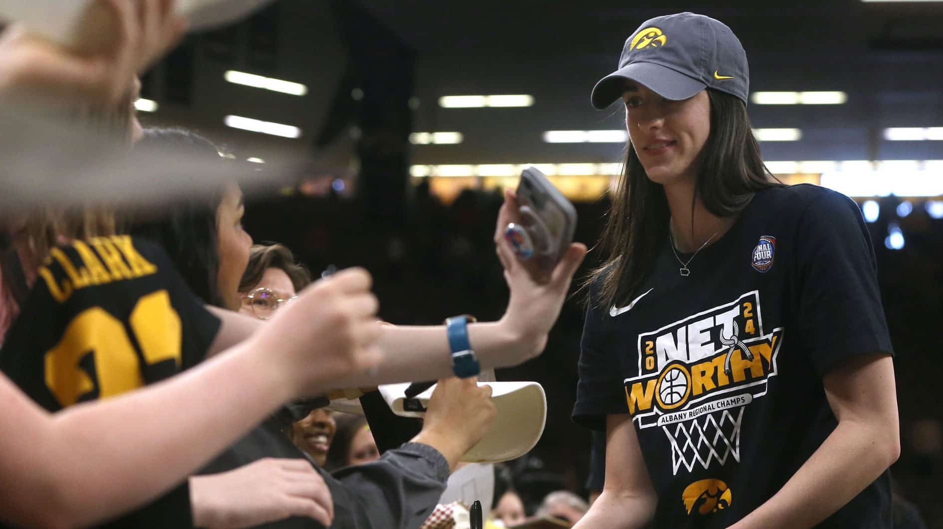 Caitlin Clark signs autographs after a celebration of the Iowa womenâ€™s basketball team Wednesday, April 10, 2024 at Carver-Hawkeye Arena in Iowa City, Iowa