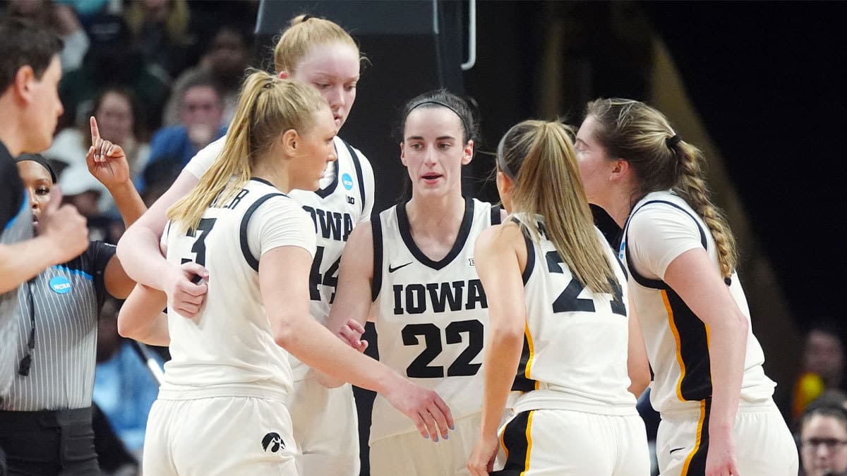 Iowa Hawkeyes guard Caitlin Clark (22) talks with teammates in a huddle in the fourth quarter against the LSU Lady Tigers in the finals of the Albany Regional in the 2024 NCAA Tournament at MVP Arena