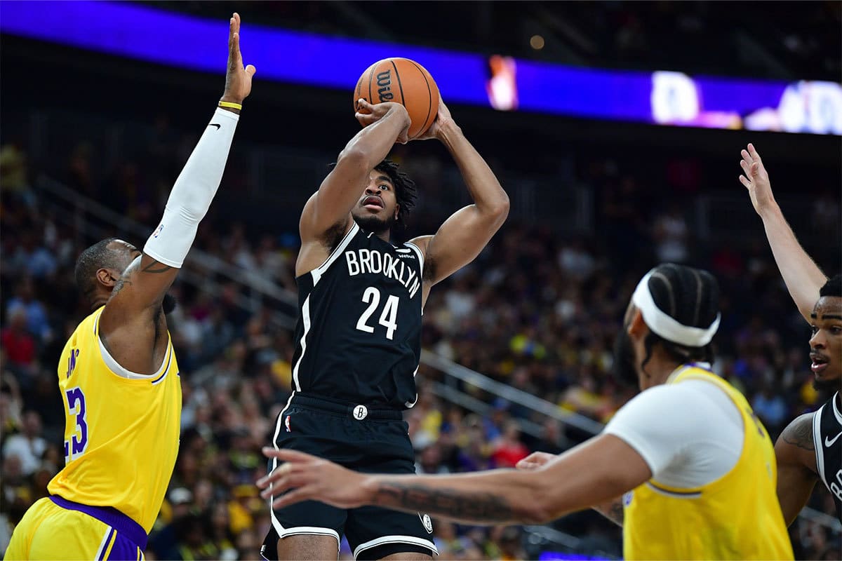 Brooklyn Nets guard Cam Thomas (24) shoots against Los Angeles Lakers forward LeBron James (23) during the first half at T-Mobile Arena.