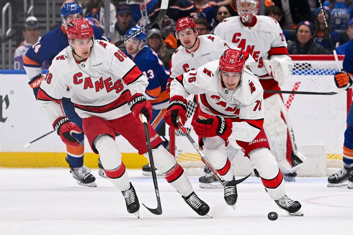 Carolina Hurricanes defenseman Brady Skjei (76) and Carolina Hurricanes center Martin Necas (88) start a fast break against the New York Islanders during the third period in game three of the first round of the 2024 Stanley Cup Playoffs at UBS Arena.