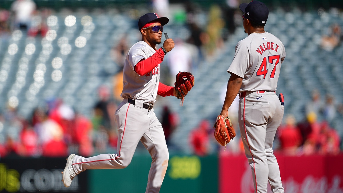 Boston Red Sox outfielder Ceddanne Rafaela (43) and second baseman Enmanuel Valdez (47) celebrate the victory against the Los Angeles Angels at Angel Stadium.