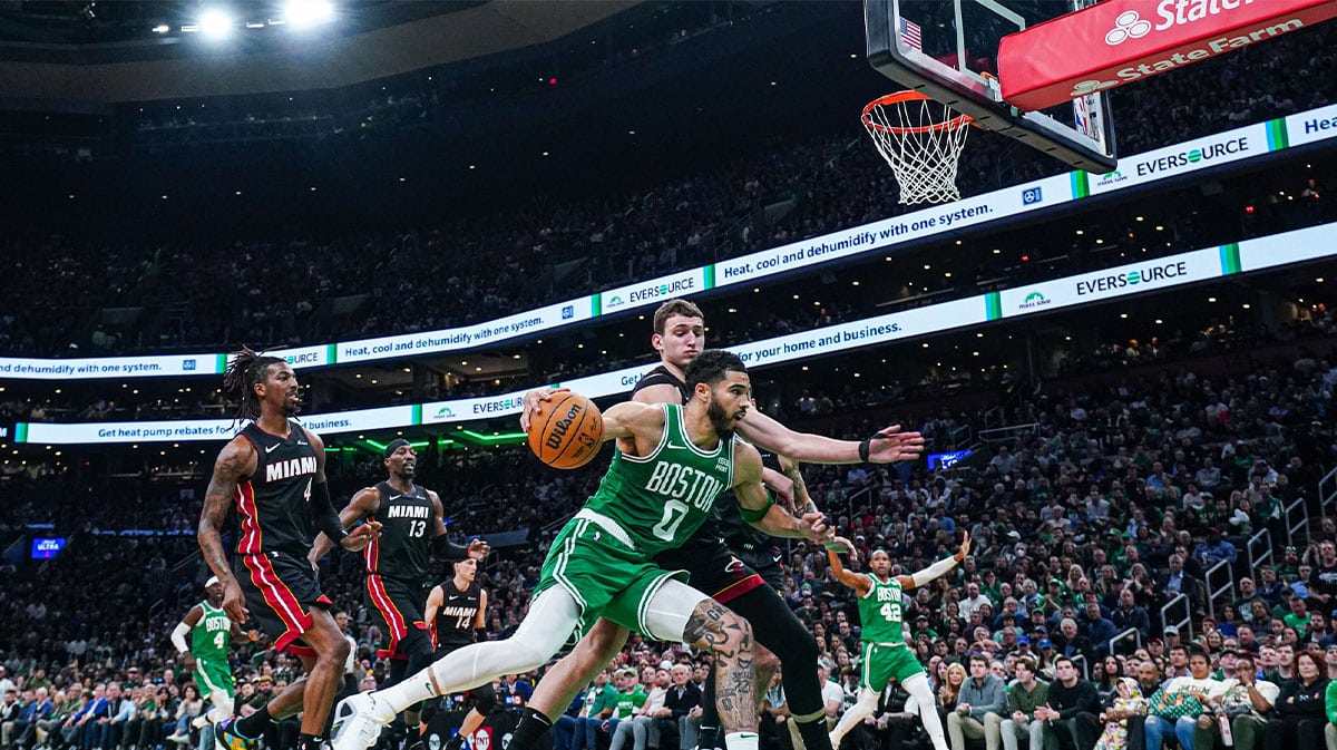 Boston Celtics forward Jayson Tatum (0) drives the ball against Miami Heat forward Nikola Jovic (5) in the second quarter during game two of the first round for the 2024 NBA playoffs at TD Garden. 