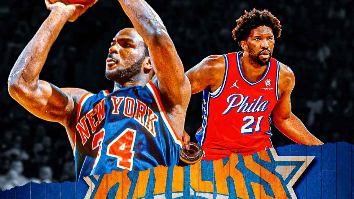 Knicks' Charles Oakley stands next to 76ers' Joel Embiid holding a donut
