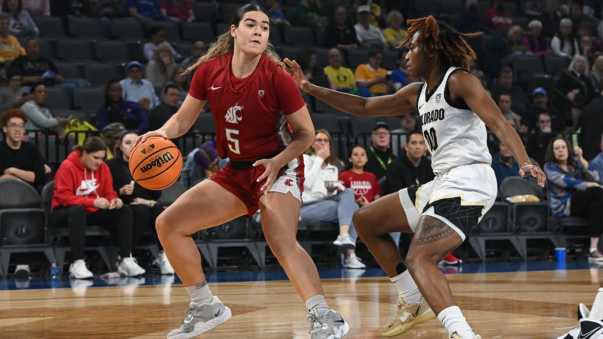 Washington State Cougars guard Charlisse Leger-Walker (5) is guarded by Colorado Buffaloes guard Jaylyn Sherrod (00).