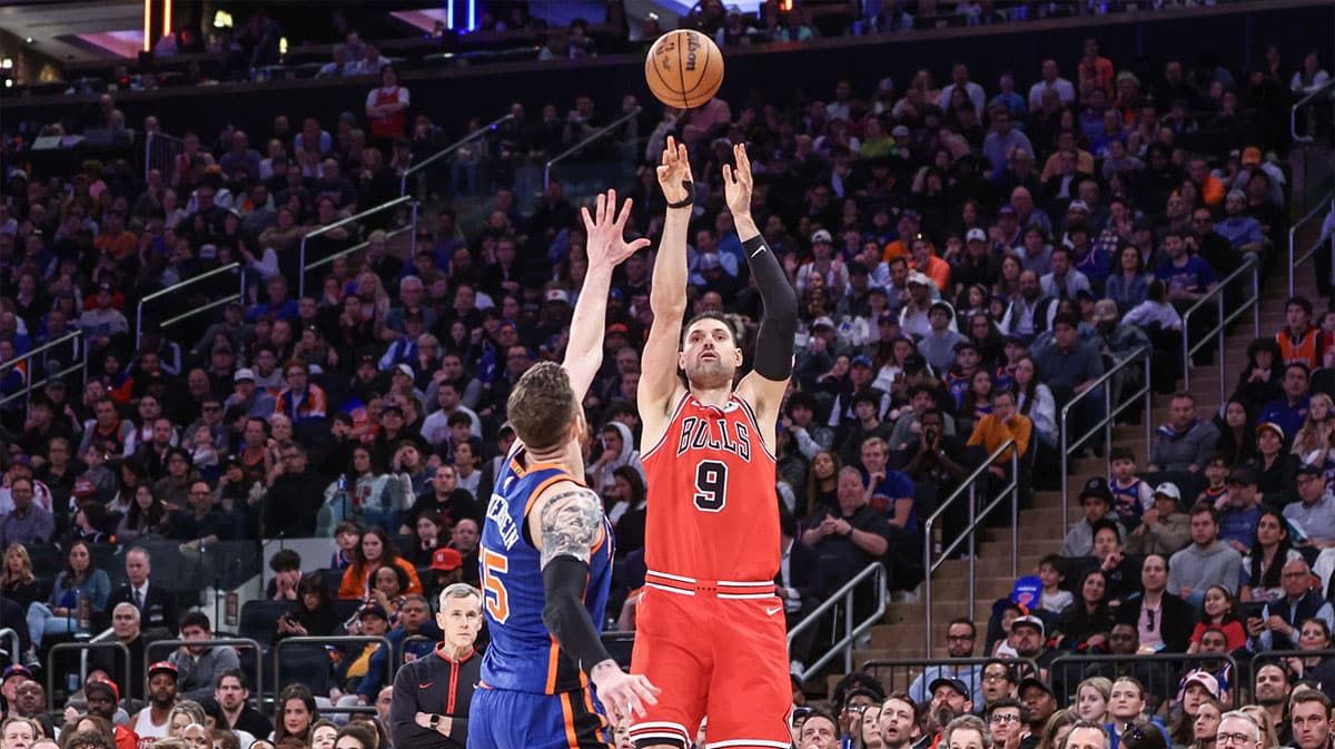 Chicago Bulls center Nikola Vucevic (9) takes a three-point shot past New York Knicks center Isaiah Hartenstein (55) in the fourth quarter at Madison Square Garden. 