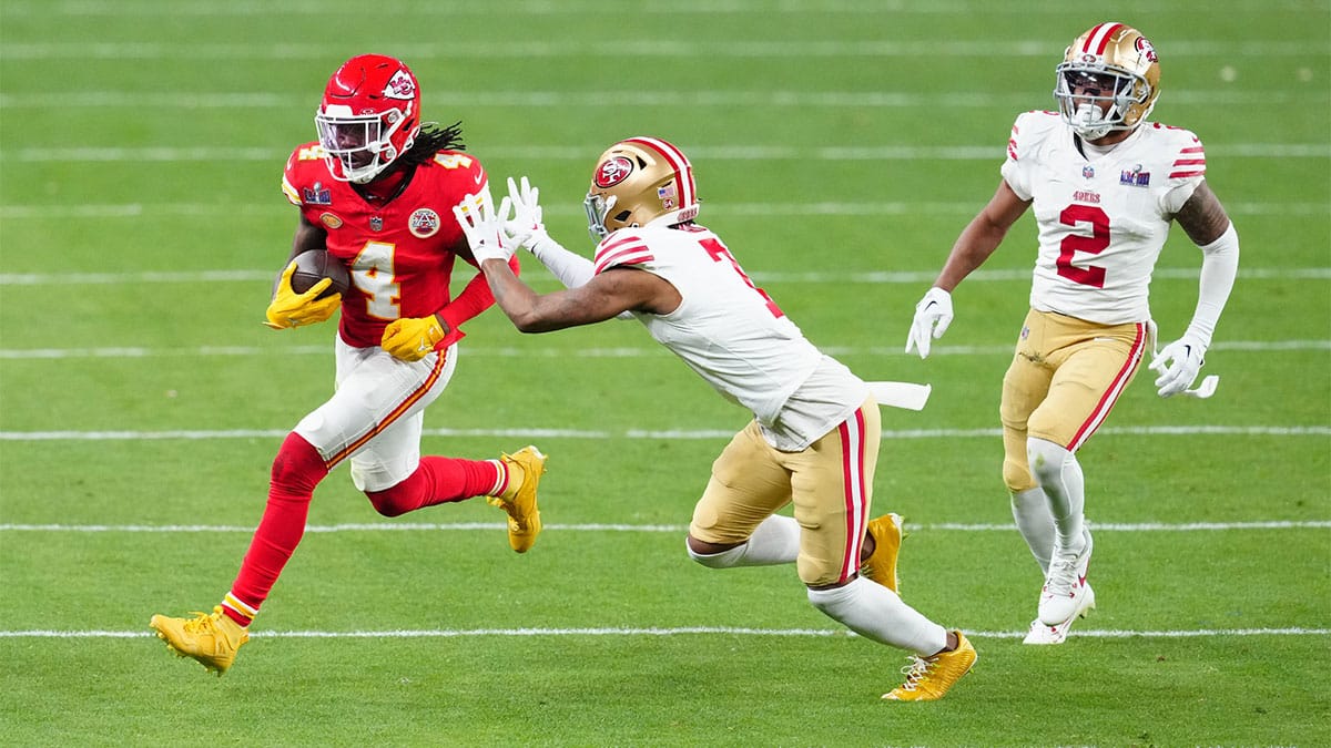 Kansas City Chiefs wide receiver Rashee Rice (4) catches a pass against San Francisco 49ers cornerback Charvarius Ward (7) during overtime in Super Bowl LVIII at Allegiant Stadium