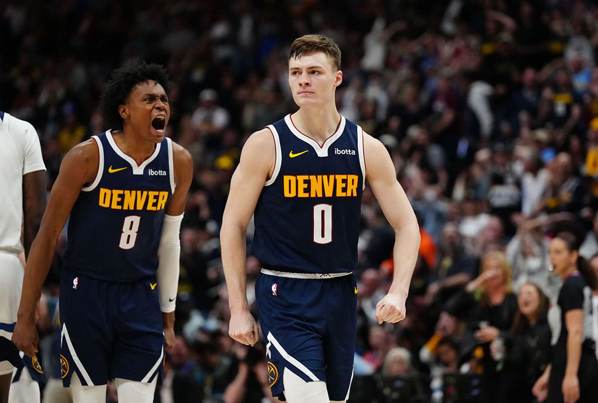 Denver Nuggets guard Christian Braun (0) and forward Peyton Watson (8) react in the fourth quarter against the Minnesota Timberwolves at Ball Arena. 