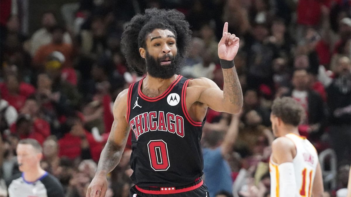 Chicago Bulls guard Coby White (0) gestures after making a three point basket against the Atlanta Hawks during the second half during a play-in game of the 2024 NBA playoffs at United Center.