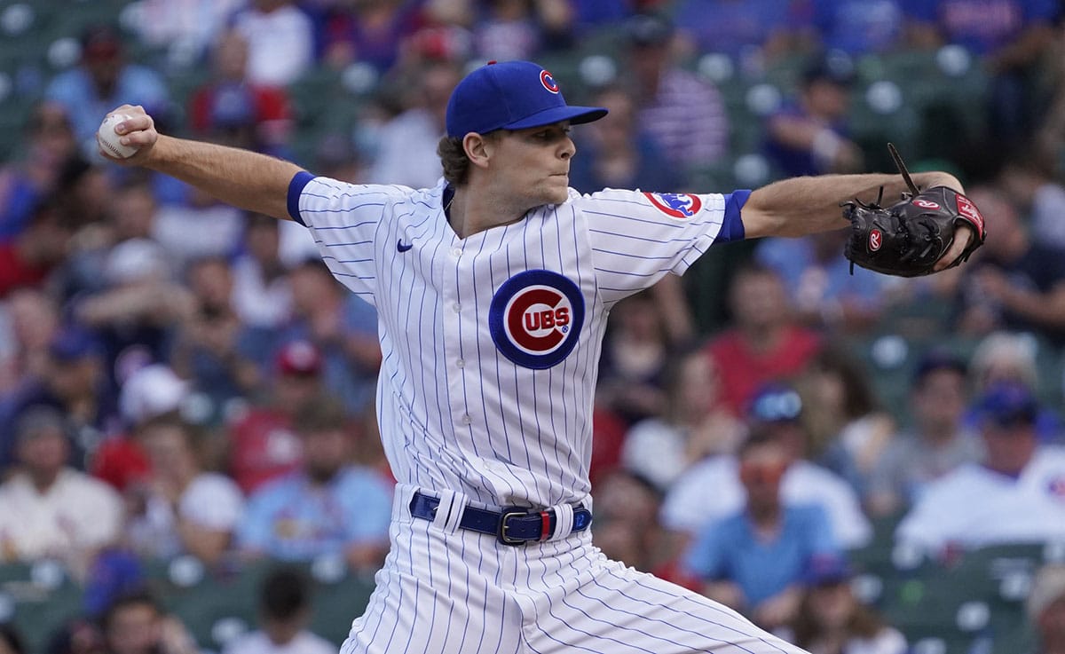 Chicago Cubs relief pitcher Codi Heuer (12) pitches against the St. Louis Cardinals during the eighth inning at Wrigley Field.