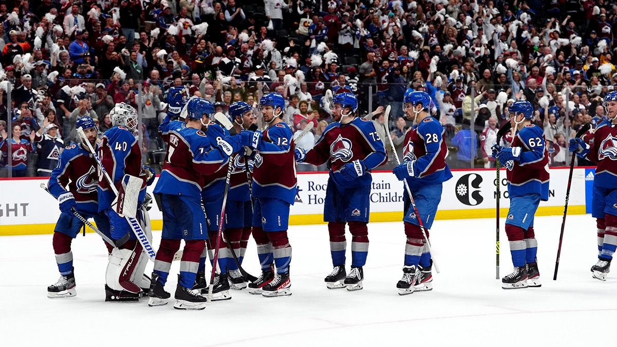 Members of the Colorado Avalanche celebrate defeating the Winnipeg Jets following game four of the first round of the 2024 Stanley Cup Playoffs at Ball Arena.