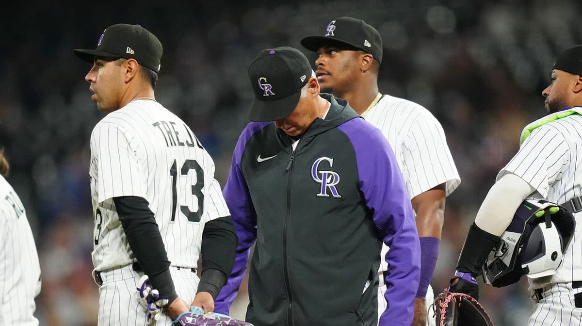 Colorado Rockies manager Bud Black (10) on the mound in the sixth inning against the Chicago Cubs at Coors Field.