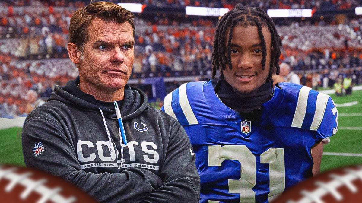 Chris Ballard on one side breathing fire, Adonai Mitchell on the other side in an Indianapolis Colts uniform
