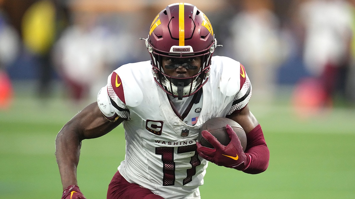 Washington Commanders wide receiver Terry McLaurin (17) carries the ball against the Los Angeles Rams in the second half at SoFi Stadium.