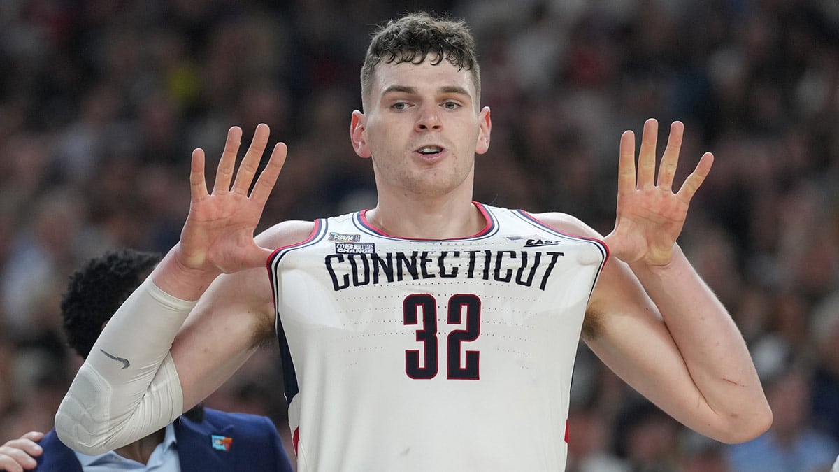 Connecticut Huskies center Donovan Clingan (32) celebrates defeating the Purdue Boilermakers in the national championship game of the Final Four of the 2024 NCAA Tournament at State Farm Stadium. 