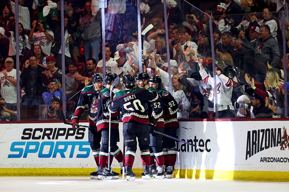 The Arizona Coyotes celebrate a goal by left wing Lawson Crouse (67) during the third period against the Edmonton Oilers at Mullett Arena.