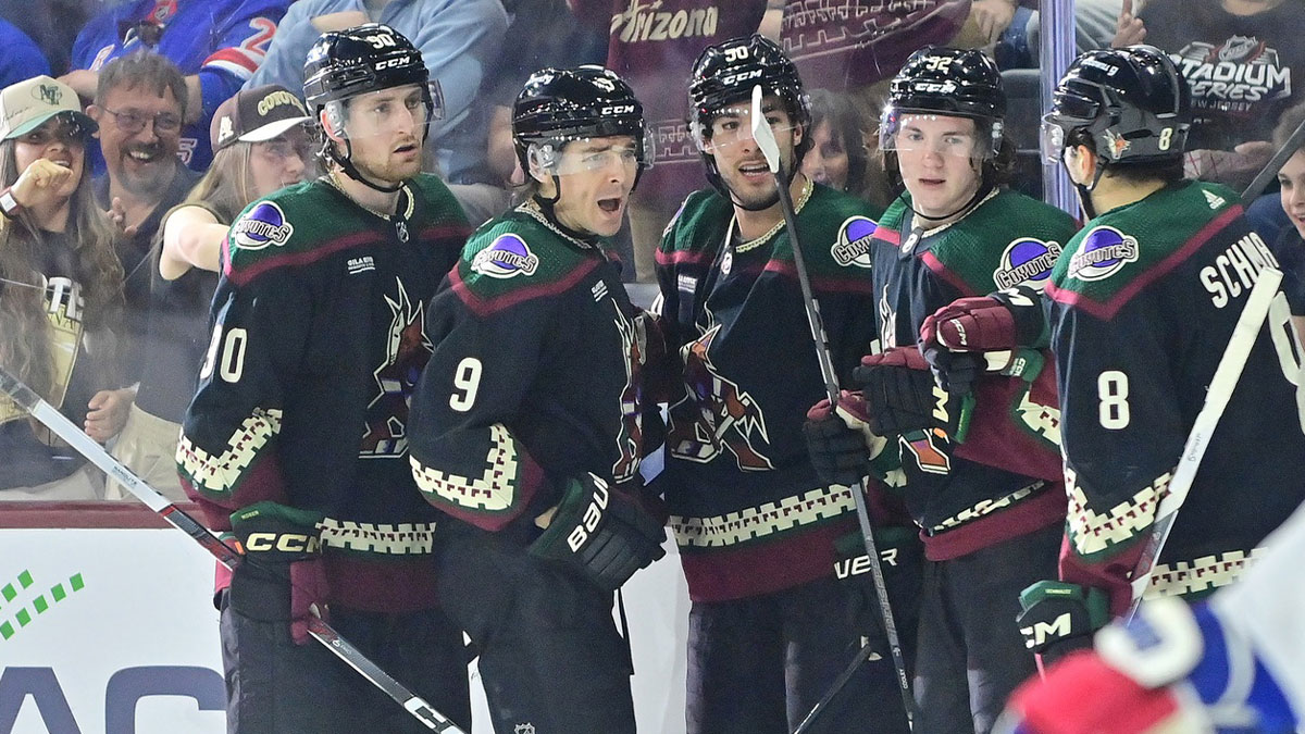  Arizona Coyotes right wing Clayton Keller (9) celebrates with defenseman J.J. Moser (90), defenseman Sean Durzi (50), center Logan Cooley (92), and center Nick Schmaltz (8) after scoring a goal in the second period against the New York Rangers at Mullett Arena.