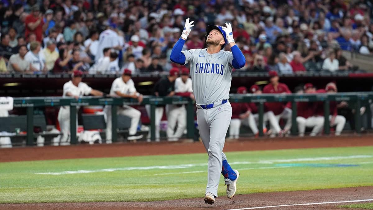 Apr 15, 2024; Phoenix, Arizona, USA; Chicago Cubs first baseman Michael Busch celebrates after hitting a solo home run against the Arizona Diamondbacks during the second inning at Chase Field. All players wore number 42 to commemorate Jackie Robinson Day.