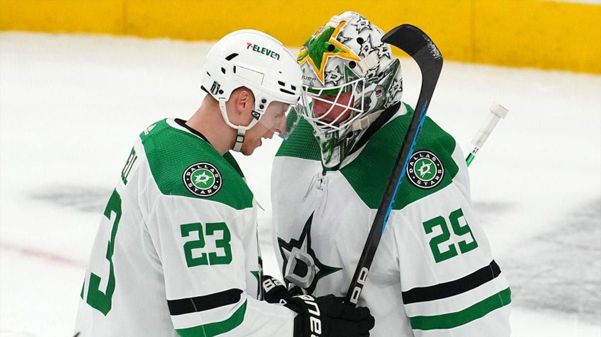 Dallas Stars defenseman Esa Lindell (23) congratulates goaltender Jake Oettinger (29) after the Dallas Stars defeated the Vegas Golden Knights 4-2 in game four of the first round of the 2024 Stanley Cup Playoffs at T-Mobile Arena.