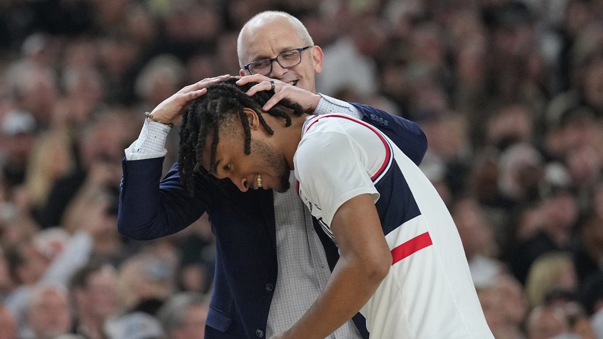 Connecticut Huskies head coach Dan Hurley celebrates with Connecticut Huskies guard Stephon Castle (5) in the second half against the Purdue Boilermakers in the national championship game of the Final Four of the 2024 NCAA Tournament at State Farm Stadium. 