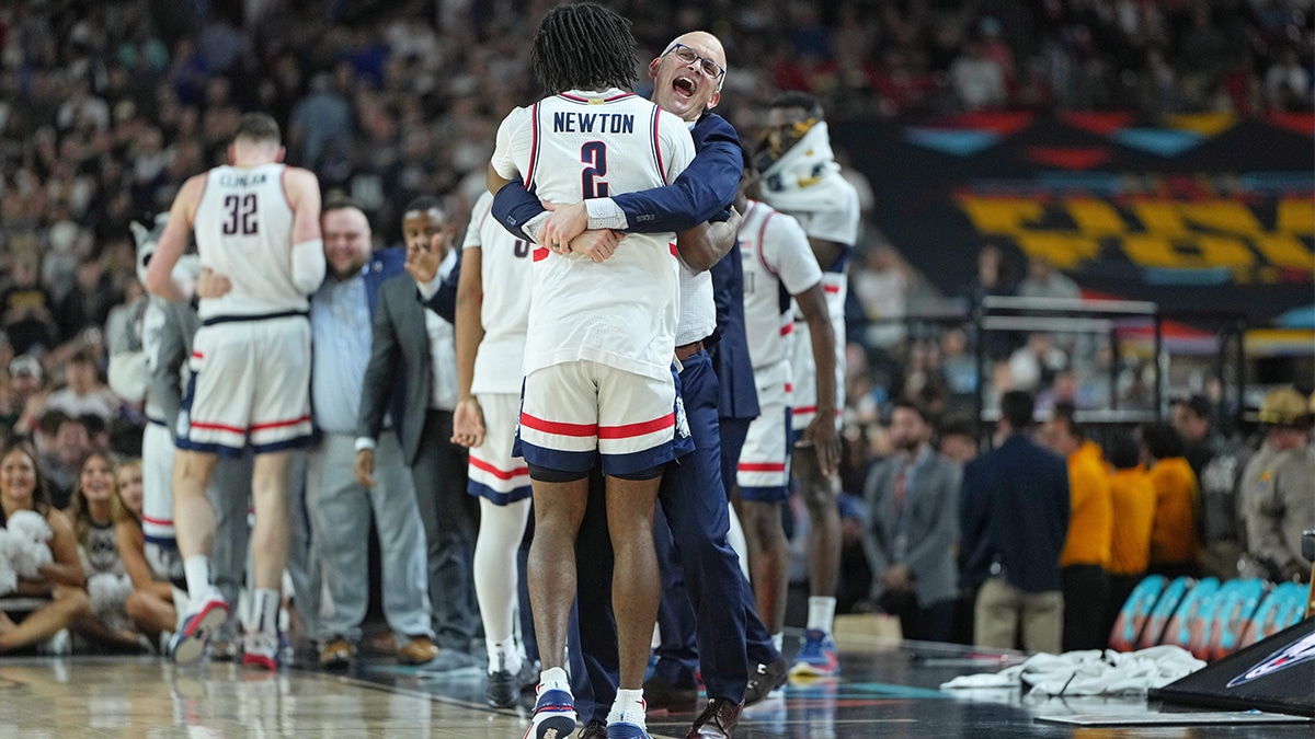 Connecticut Huskies head coach Dan Hurley hugs guard Tristen Newton (2) during the second half of the national championship game of the Final Four of the 2024 NCAA Tournament at State Farm Stadium