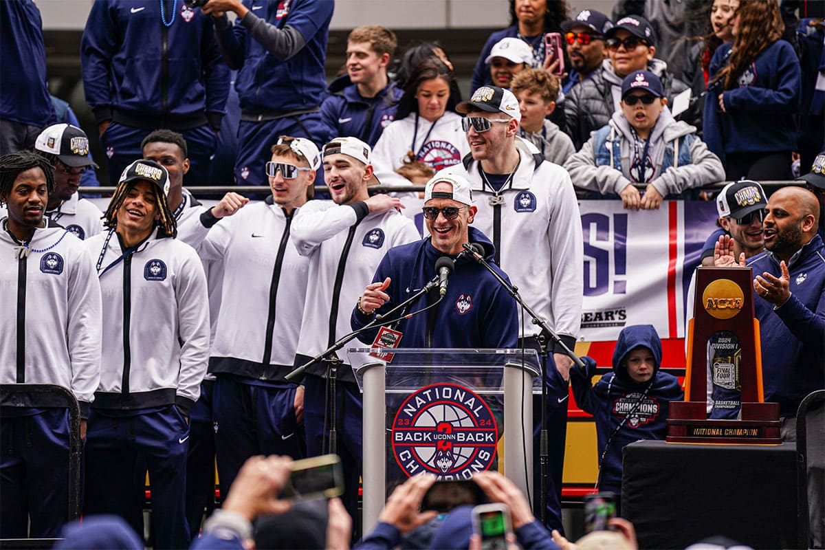 UConn Huskies head coach Dan Hurley speaks to a large crowd of fans outside the XL Center after the teams victory parade.