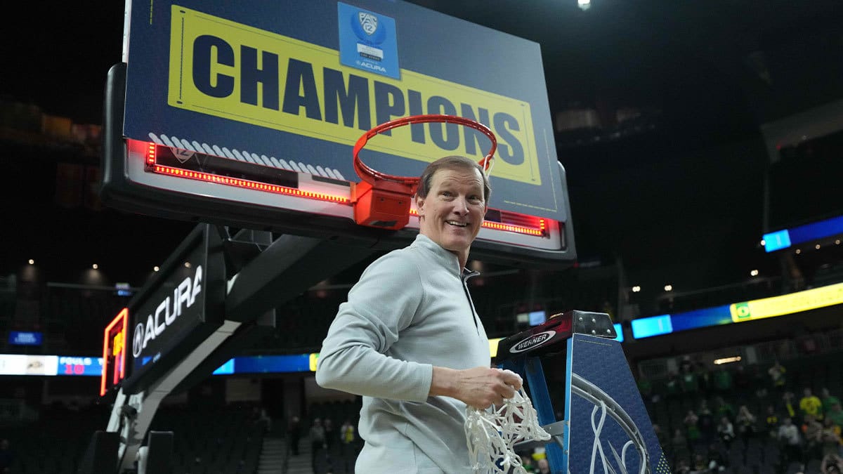 Oregon Ducks head coach Dana Altman cuts down the net after the Pac-12 Championship game against the Colorado Buffaloes at T-Mobile Arena.