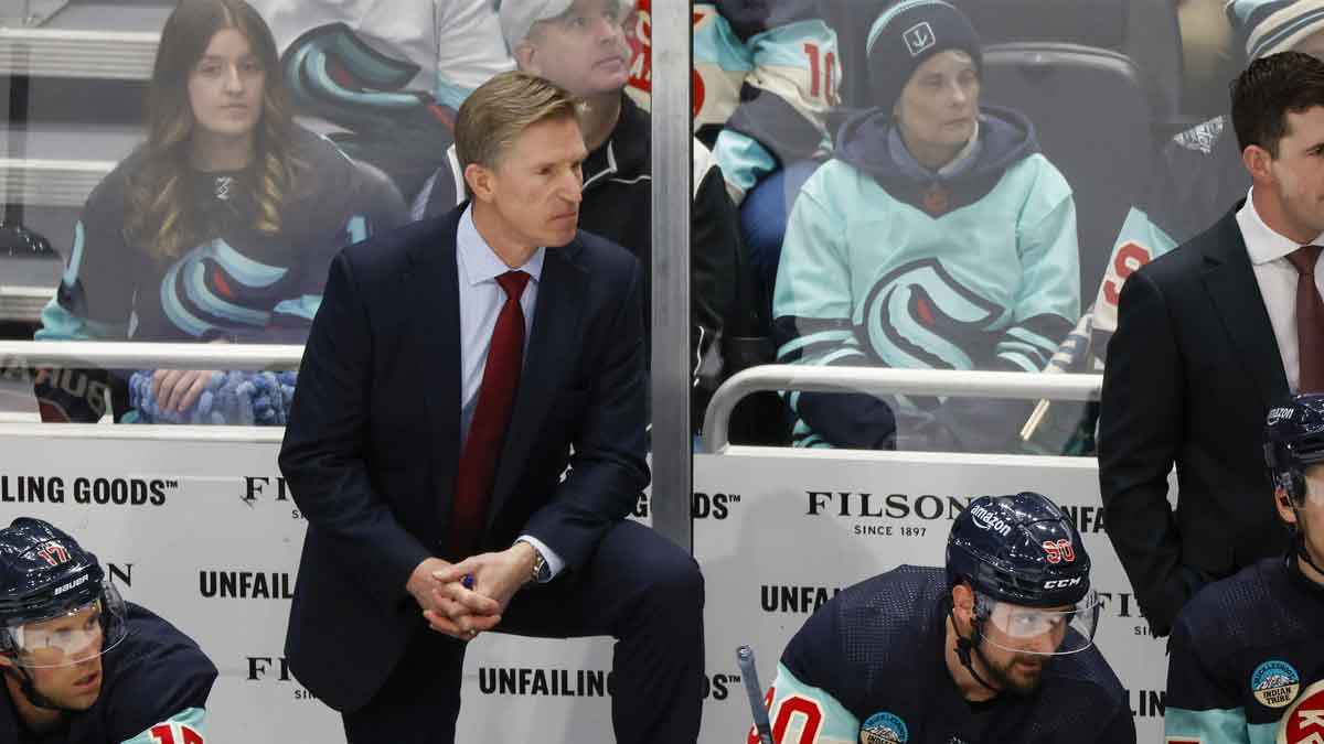 Seattle Kraken head coach Dave Hakstol, back left, stands behind the bench as center Jaden Schwartz (17) and left wing Tomas Tatar (90) watch the final seconds of the third period against the Montreal Canadiens at Climate Pledge Arena.