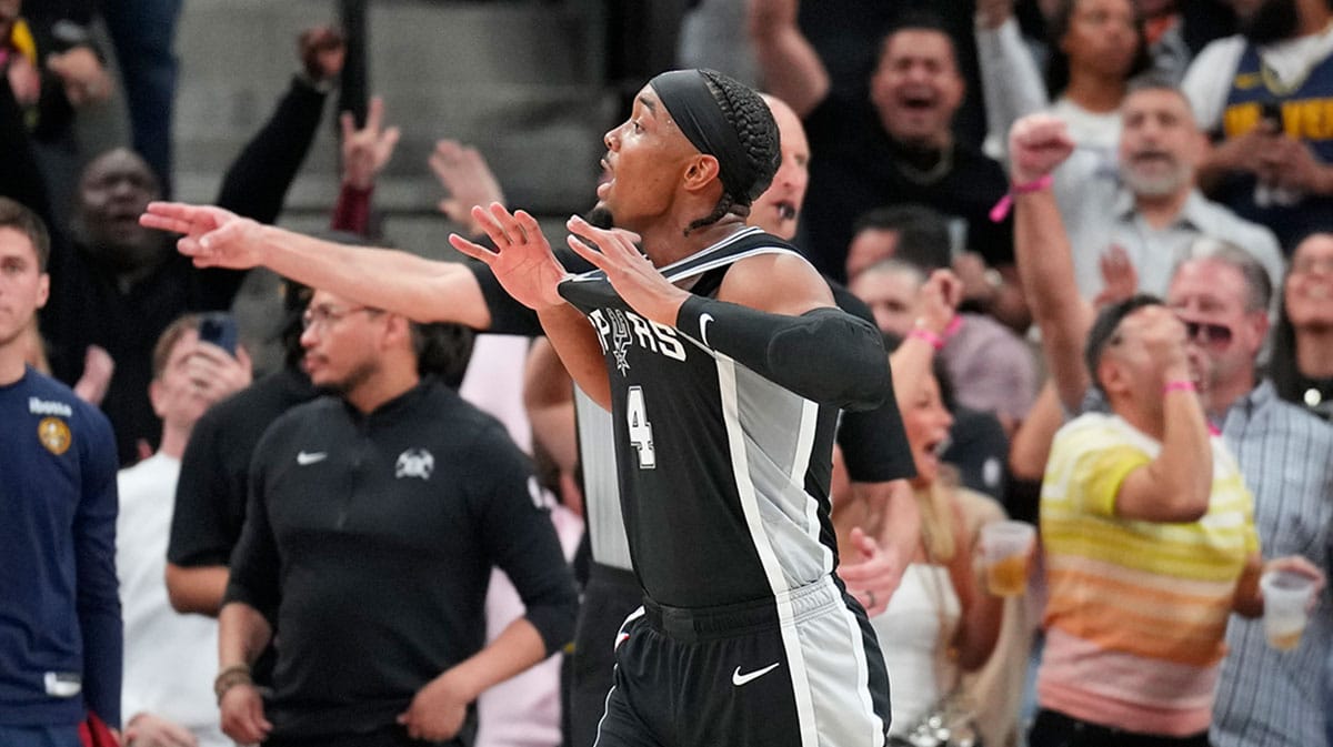 San Antonio Spurs guard Davonte' Graham (4) reacts after scoring a three-point basket during the second half against the Denver Nuggets at Frost Bank Center.