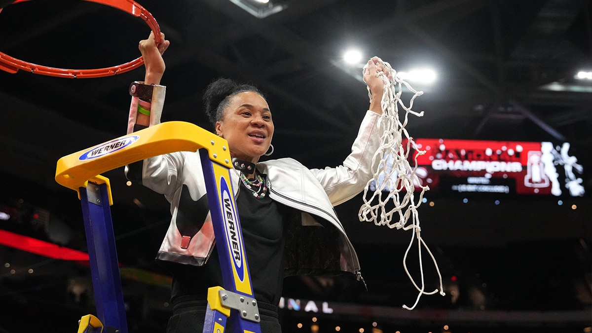 South Carolina Gamecocks head coach Dawn Staley cuts down the net after defeating the Iowa Hawkeyes in the finals of the Final Four of the womens 2024 NCAA Tournament at Rocket Mortgage FieldHouse