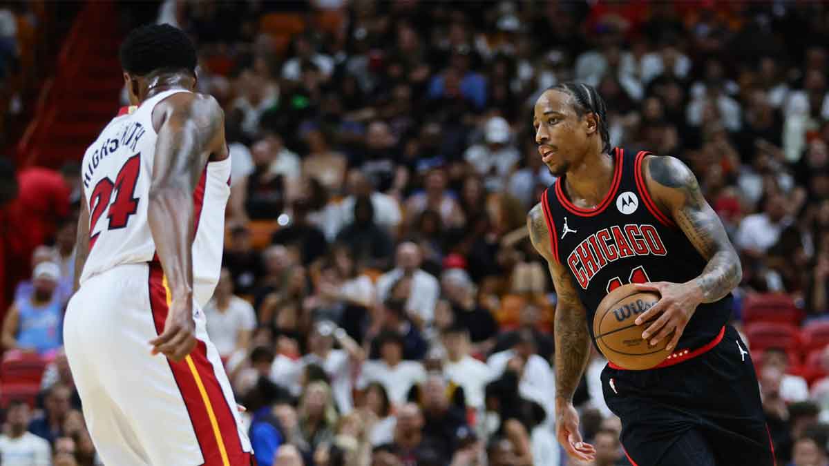 Chicago Bulls forward DeMar DeRozan (11) dribbles the basketball against the Miami Heat in the second quarter during a play-in game of the 2024 NBA playoffs at Kaseya Center.