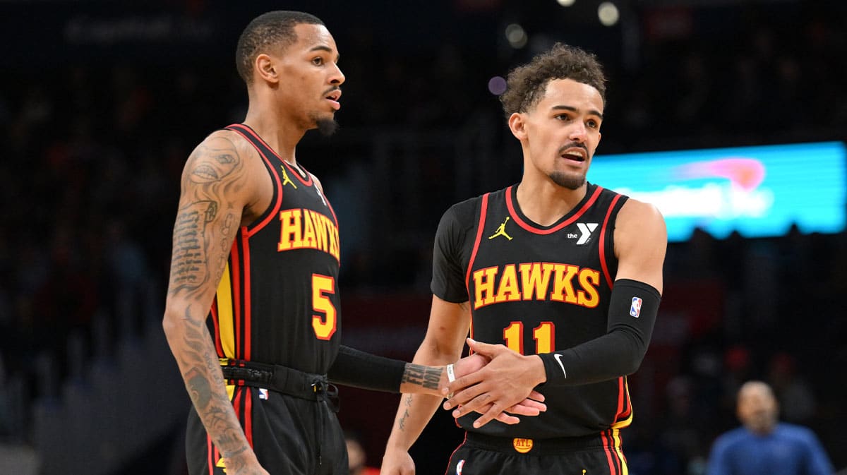  Atlanta Hawks guard Dejounte Murray (5) and guard Trae Young (11) celebrate during the second half against the Washington Wizards at Capital One Arena.