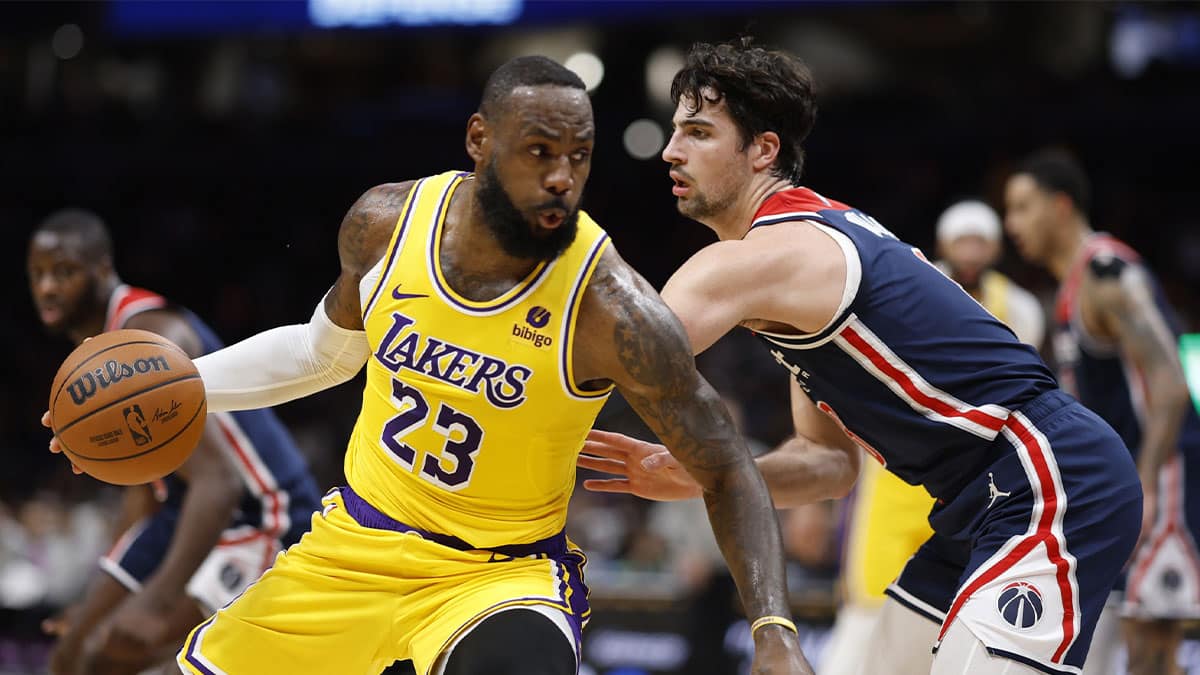 Los Angeles Lakers forward LeBron James (23) drives to the basket as Washington Wizards forward Deni Avdija (8) defends in the first half at Capital One Arena.