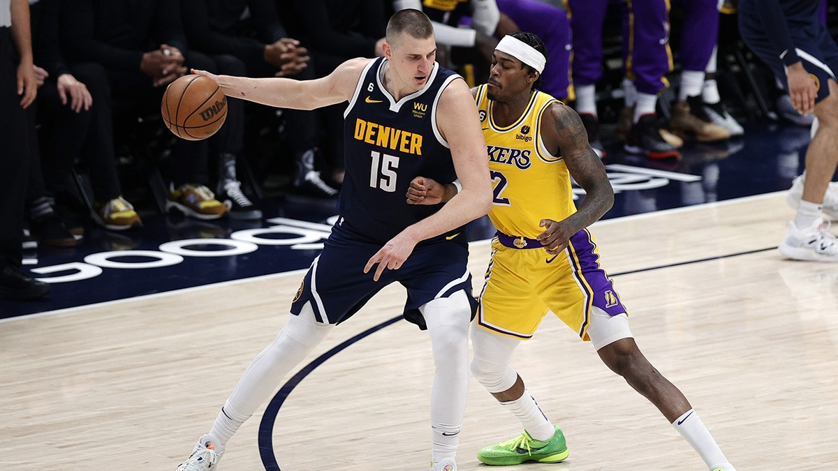 May 18, 2023; Denver, Colorado, USA; Denver Nuggets center Nikola Jokic (15) controls the ball against Los Angeles Lakers forward Jarred Vanderbilt (2) in the third quarter during game two of the Western Conference Finals for the 2023 NBA playoffs at Ball Arena. Mandatory Credit: Isaiah J. Downing-USA TODAY Sports