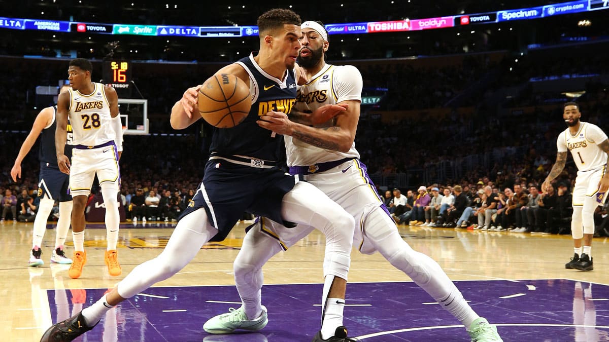 Apr 27, 2024; Los Angeles, California, USA; Denver Nuggets forward Michael Porter Jr. (1) battles for position with Los Angeles Lakers forward Anthony Davis (3) during the third quarter in game four of the first round for the 2024 NBA playoffs at Crypto.com Arena. Mandatory Credit: Jason Parkhurst-USA TODAY Sports