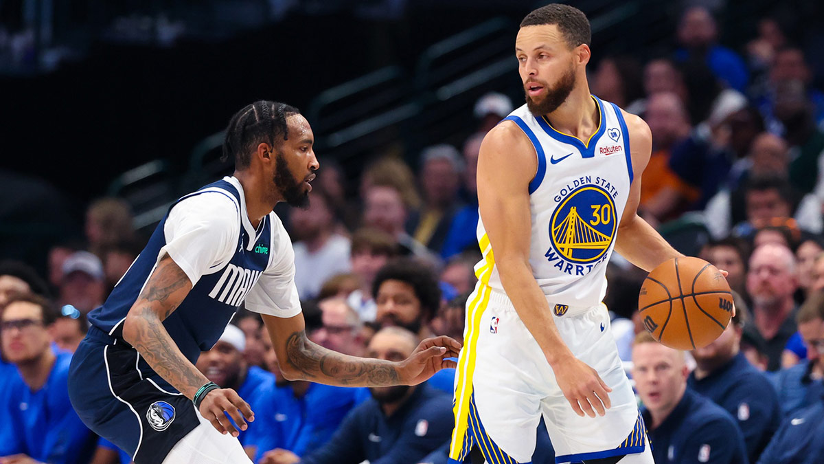 Golden State Warriors guard Stephen Curry (30) dribbles as Dallas Mavericks forward Derrick Jones Jr. (55) defends during the first quarter at American Airlines Center. 