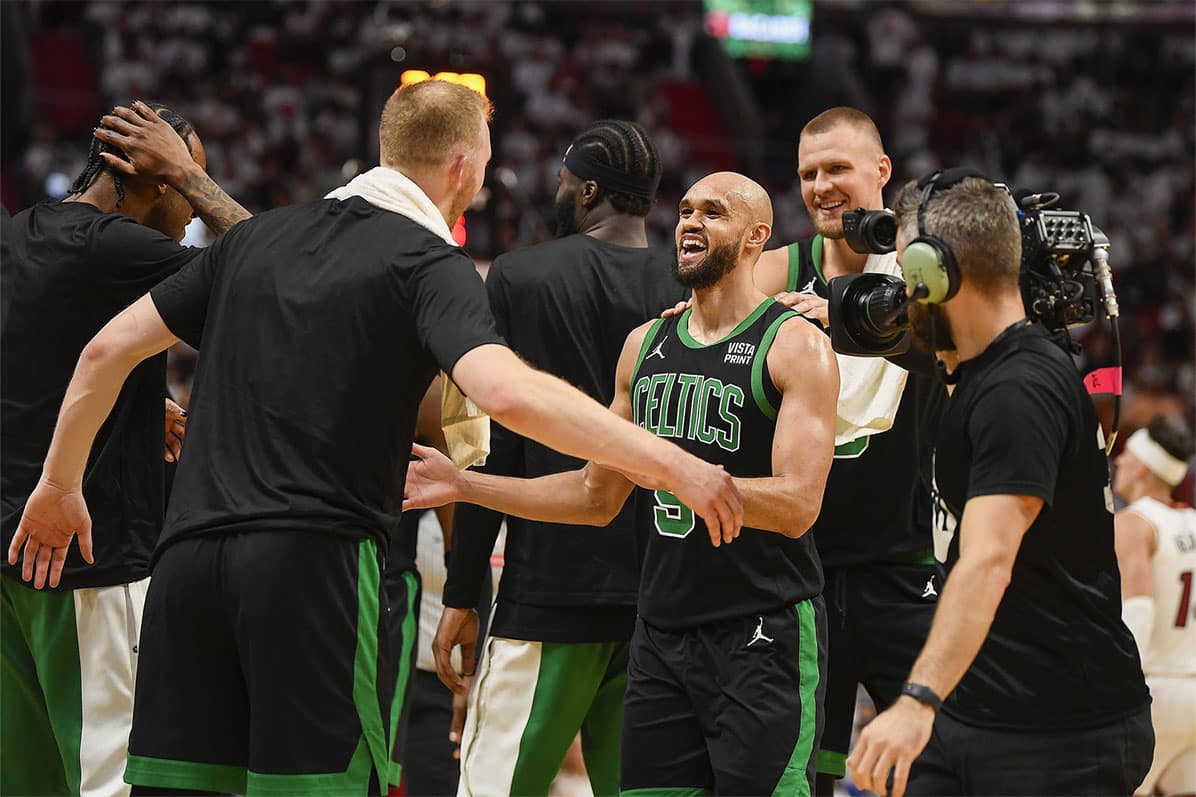  Boston Celtics guard Derrick White (9) celebrates a Celtics lead over the Miami Heat during a timeout in the second quarter of game four of the first round for the 2024 NBA playoffs at Kaseya Center.