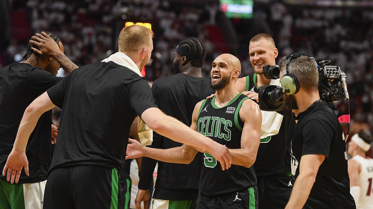 Boston Celtics guard Derrick White (9) celebrates a Celtics lead over the Miami Heat during a timeout in the second quarter of game four of the first round for the 2024 NBA playoffs at Kaseya Center. 