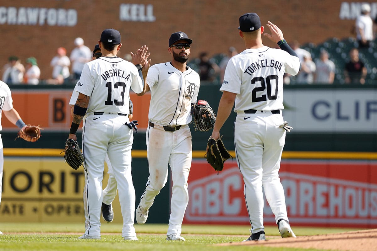 Detroit Tigers outfielder Riley Greene (31) high fives teammates following the Detroit Tigers win over the Minnesota Twins at Comerica Park.
