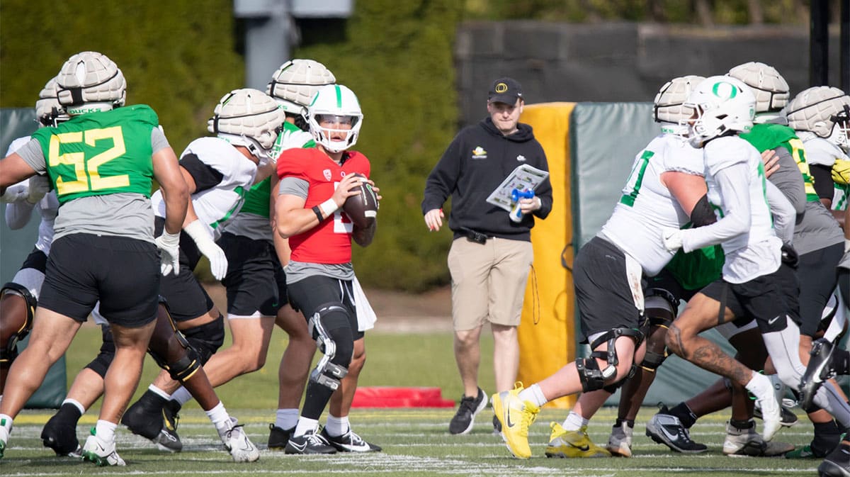 Oregon quarterback Dillon Gabriel looks to pass during practice with the Ducks 