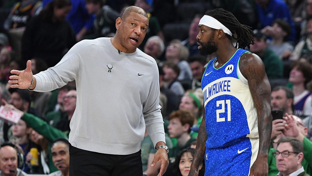 Milwaukee Bucks head coach Doc Rivers talks with Milwaukee Bucks guard Patrick Beverley (21) during a time out at Fiserv Forum.