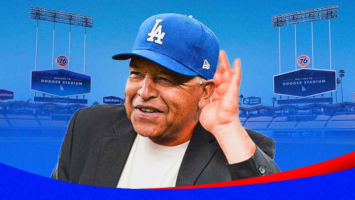 Dodgers manager Dave Roberts cupping his ear