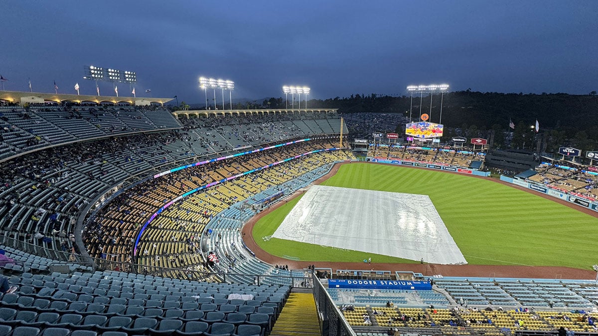 General view of playing field with the tarp before the game between the Los Angeles Dodgers and San Diego Padres at Dodger Stadium.