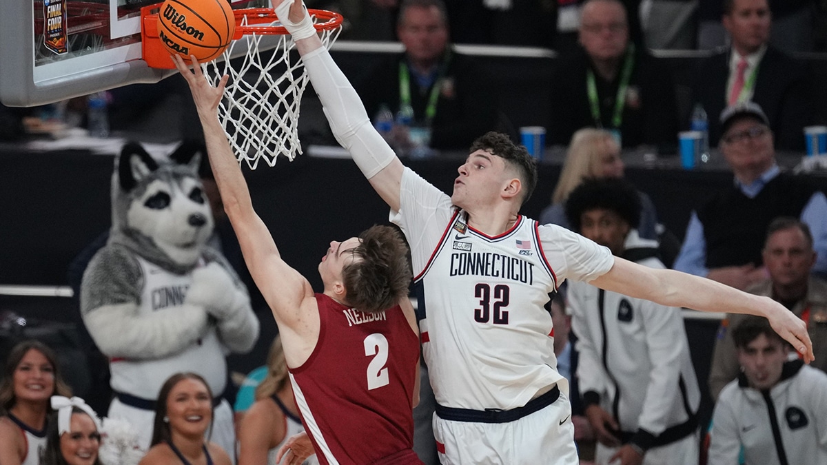 Alabama Crimson Tide forward Grant Nelson (2) shoots against Connecticut Huskies center Donovan Clingan (32) in the semifinals of the men's Final Four of the 2024 NCAA Tournament at State Farm Stadium.