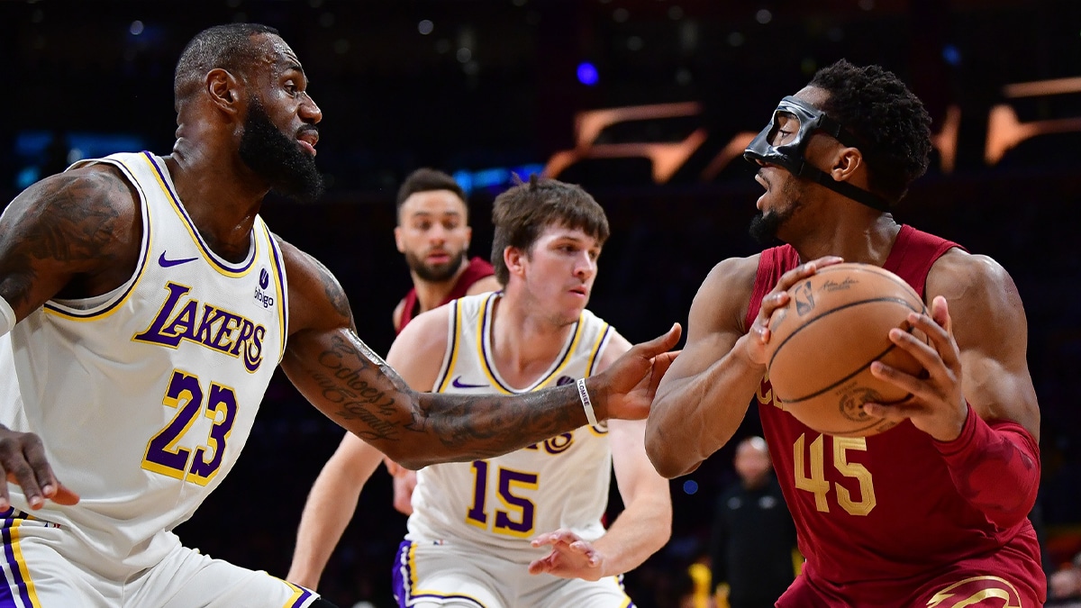 Cleveland Cavaliers guard Donovan Mitchell (45) controls the ball against Los Angeles Lakers forward LeBron James (23) during the first half at Crypto.com Arena