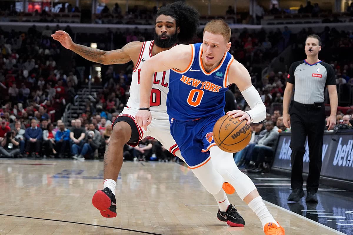 Chicago Bulls guard Coby White (0) defends New York Knicks guard Donte DiVincenzo (0) during the second half at United Center.